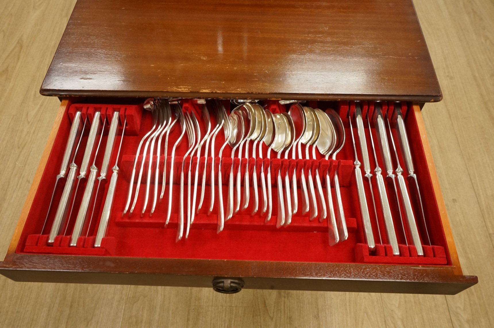 A mahogany canteen containing an Elkingtons suite of plated cutlery. 59cm wide x 42cm deep x 62cm high. Condition - table scratched cutlery good